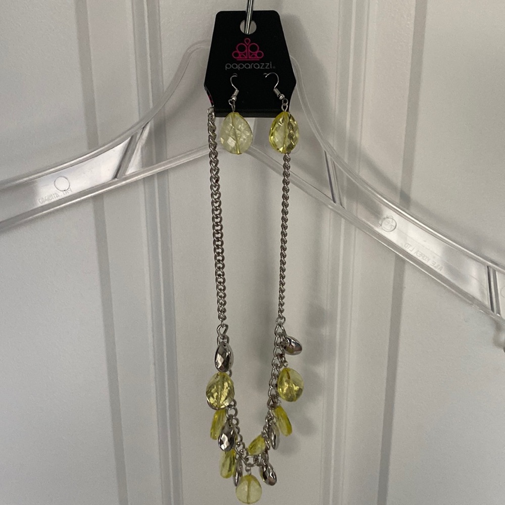 Two Paparazzi necklaces with earrings.